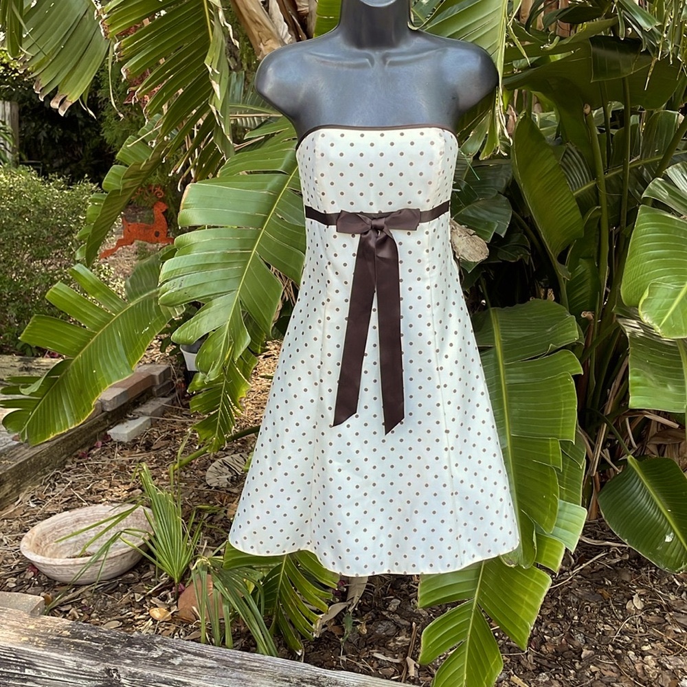 Strapless polkadot, satin fit, and flare with bow dress by Jessica McCli…